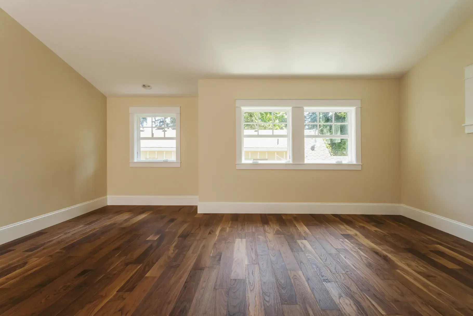 Hardwood, laminate and vinyl plank flooring samples side by side